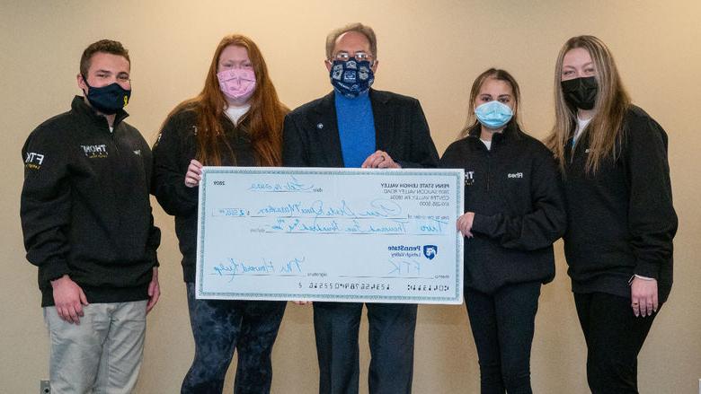 PSU-LV THON Dancers present check to donor Howard Kulp 